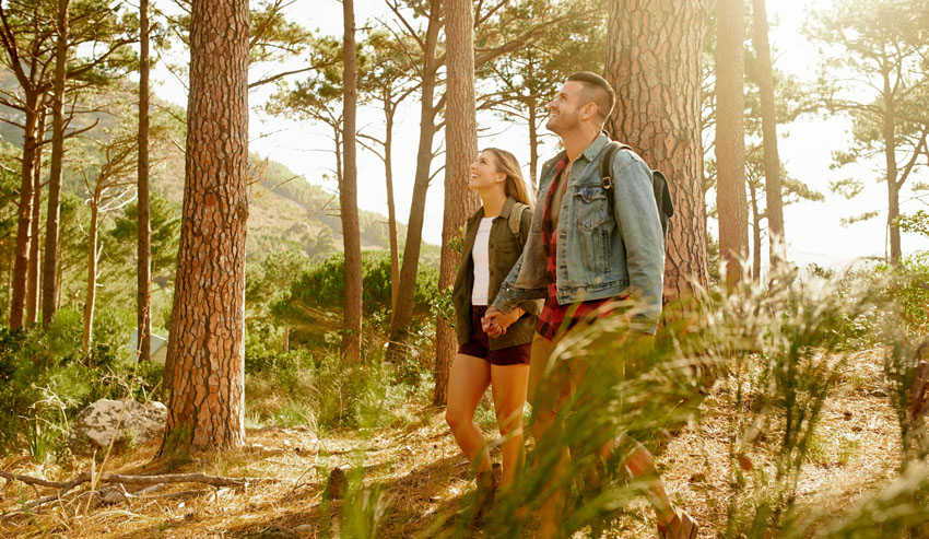 Couple on vacation hiking around in the woods